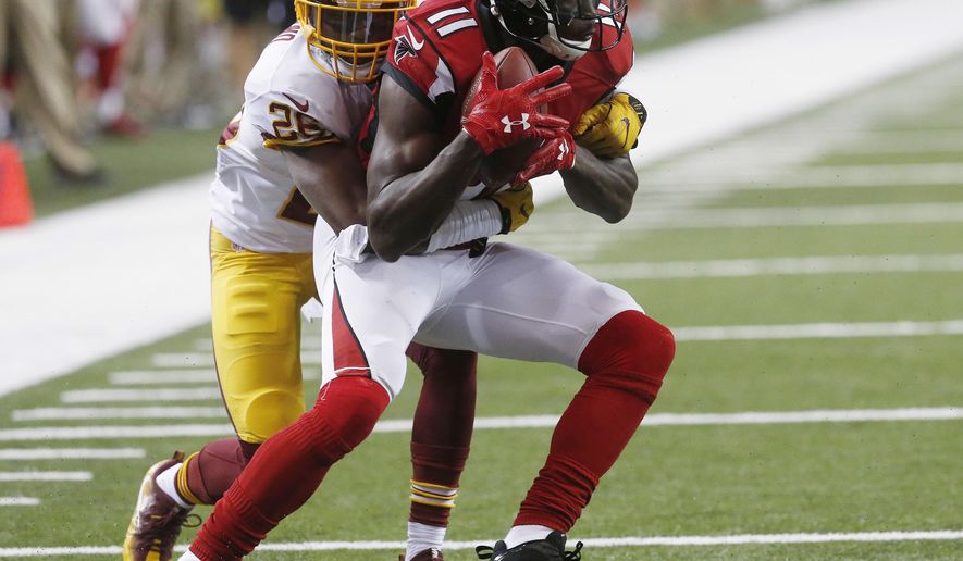 FILE - In this Aug. 11, 2016, file photo, Atlanta Falcons wide receiver Julio Jones (11) makes a catch against Washington Redskins cornerback Bashaud Breeland during a preseason NFL football game in Atlanta. Coach Dan Quinn expects All-Pro receiver Jones to be full strength when the Falcons install their game plan for Sunday’s opener against Tampa Bay. Jones sprained his ankle in the third preseason game at Miami, but Quinn believes he will fully participate on Wednesday, Sept. 7. (AP Photo/John Bazemore, File)