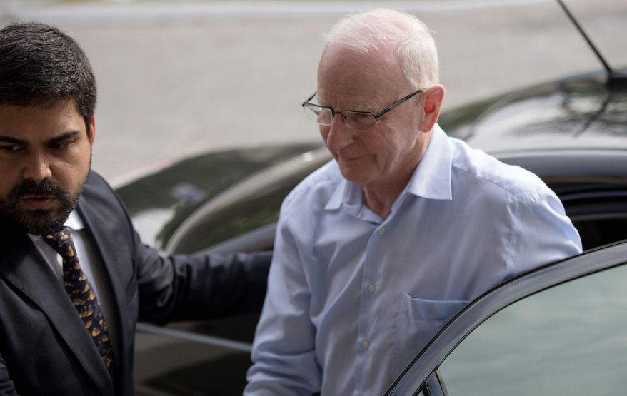 Ireland's Olympic Council President Patrick Hickey arrives to a police station in Rio de Janeiro, Brazil, Tuesday, Sept. 6, 2016. The high-ranking Olympic official is declining to answer police questions related to alleged ticket scalping during last month's Olympic Games. Hickey must remain in Brazil until the probe is concluded. (AP Photo/Mauro Pimentel)