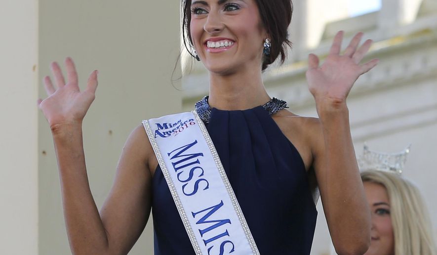 FILE - In this Tuesday, Aug. 30, 2016 file photo, Miss Missouri, Erin O'Flaherty waves as she is introduced during Miss America Pageant arrival ceremonies in Atlantic City. After competing in pageants for generations in the closet or working behind the scenes, gays and lesbians finally get to see one of their own take one of pageantry's biggest stages. O' Flaherty, will compete for the Miss America crown on Sept. 11, as the first openly lesbian contestant. (AP Photo/Mel Evans, File)