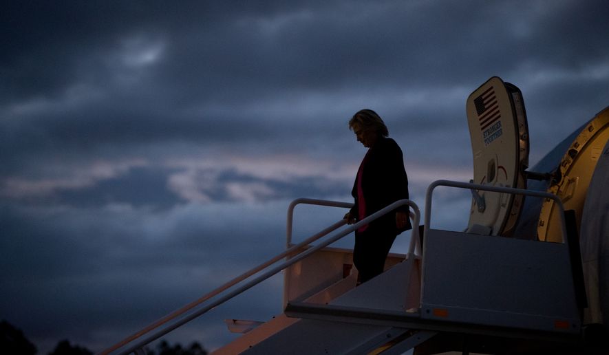 Democratic presidential candidate Hillary Clinton arrives at at Westchester County Airport in Westchester, N.Y., Tuesday, Sept. 6, 2016, from Tampa after speaking at a rally at Southern Florida University. (AP Photo/Andrew Harnik)