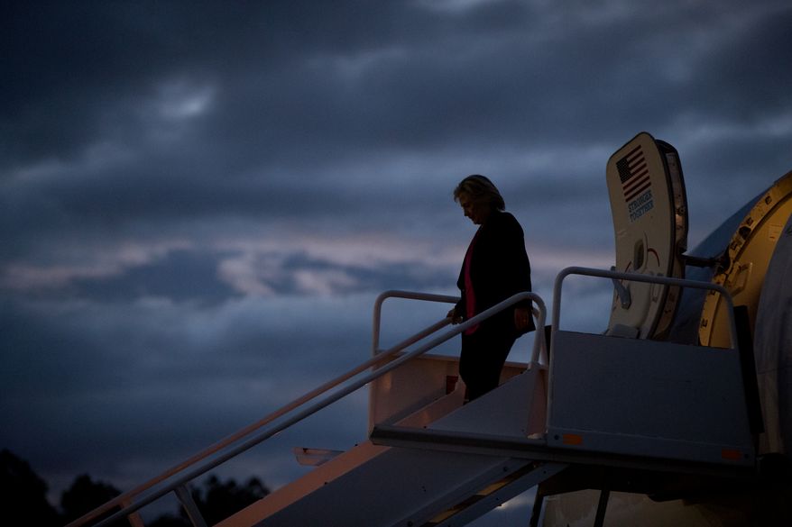 Democratic presidential candidate Hillary Clinton arrives at at Westchester County Airport in Westchester, N.Y., Tuesday, Sept. 6, 2016, from Tampa after speaking at a rally at Southern Florida University. (AP Photo/Andrew Harnik)