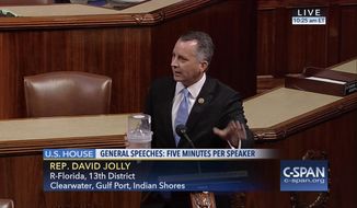 In this frame grab from video provided by C-SPAN, Rep. David Jolly, R-Fla. holds a container of mosquitoes while speaking of the House floor on Capitol Hill in Washington, Wednesday, Sept. 7, 2016. &quot;The politics of Zika are garbage right now,&quot; the Florida lawmaker said in a short, angry speech condemning Congress for failing to pass legislation providing $1.1 billion to combat the mosquito-borne virus.  (C-SPAN via AP)