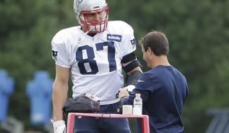 New England Patriots&#39; Rob Gronkowski (87) has his arm taped during an NFL football practice, Wednesday, Sept. 7, 2016, in Foxborough, Mass. (AP Photo/Steven Senne)