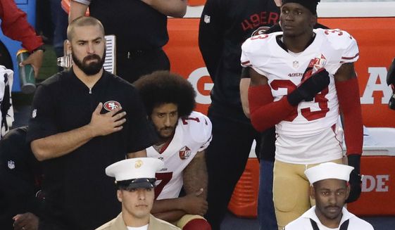 FILE - In this Thursday, Sept. 1, 2016 file photo, San Francisco 49ers quarterback Colin Kaepernick, middle, kneels during the national anthem before the team&#39;s NFL preseason football game against the San Diego Chargers, in San Diego. NFL Commissioner Roger Goodell disagrees with Kaepernick&#39;s choice to kneel during the national anthem, but recognizes the quarterback&#39;s right to protest.  (AP Photo/Chris Carlson, File)
