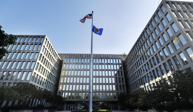 The U.S. Office of Personnel Management is photographed Tuesday, Sept. 6, 2016, in Washington. It was time to purge the hacker from the U.S. government’s computers. After secretly monitoring the hacker&#x27;s online movements for months, officials worried he was getting too close to critical information and devised a plan to expel him. Trouble was, with all their attention focused in that case, they missed the other hacker entirely. (AP Photo/Jacquelyn Martin)