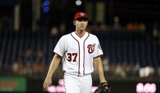 Washington Nationals starting pitcher Stephen Strasburg (37) heads to the dugout after pitching the first inning of a baseball game against the Atlanta Braves at Nationals Park, Wednesday, Sept. 7, 2016, in Washington. (AP Photo/Alex Brandon)