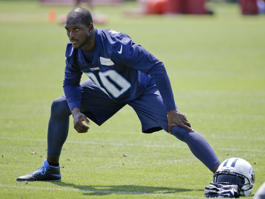 FILE - In this June 10, 2015, file photo,Tennessee Titans cornerback Jason McCourty stretches during at the team's NFL football training facility in Nashville, Tenn. Titans coach Mike Mularkey will have the chance Sunday, Sept. 11, to see something for the first time since he took over this team last November: Starting cornerbacks–McCourty and Perrish Cox–playing together. (AP Photo/Mark Humphrey, File)