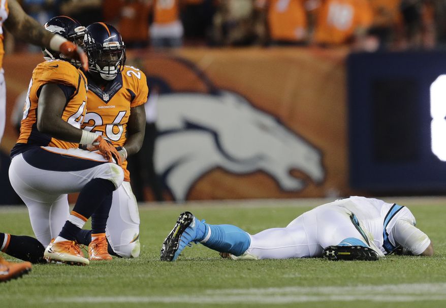 Carolina Panthers quarterback Cam Newton (1) lies on the turf after a roughing the passer penalty on Denver Broncos free safety Darian Stewart (26) during the second half of an NFL football game, Thursday, Sept. 8, 2016, in Denver. The Broncos won 21-20. (AP Photo/Joe Mahoney)