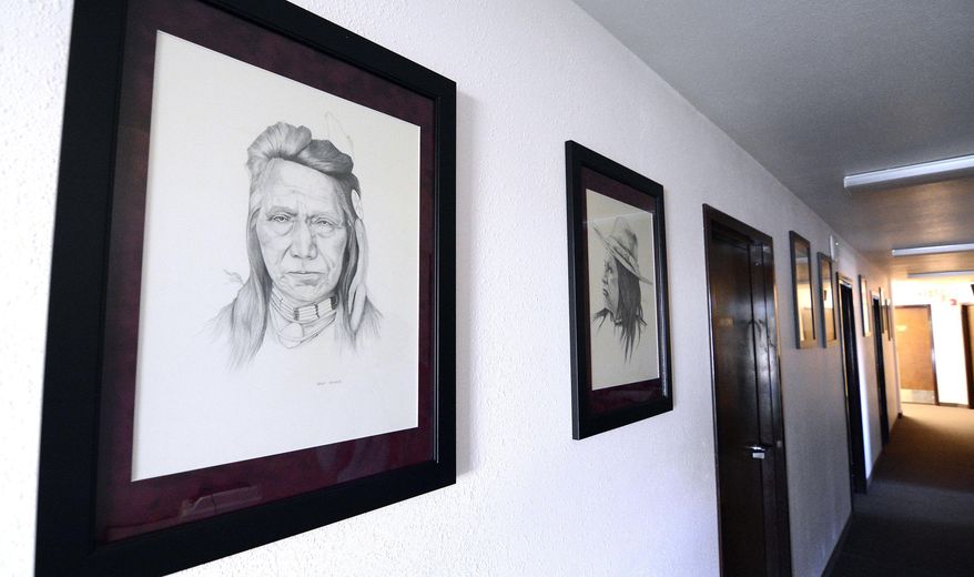 FOR RELEASE SATURDAY, SEPTEMBER 10, 2016, AT 12:01 A.M. MDT.- A group of pencil drawings of Nez Perce tribal leaders hangs in the hallway of the Nez Perce Tribal Executive Chambers Thursday, Aug. 25, 2016 in Lapwai, Idaho. The artist, Steve Allured, worked at Washington State University from 1947-72. (Kyle Mills/Lewiston Tribune via AP)