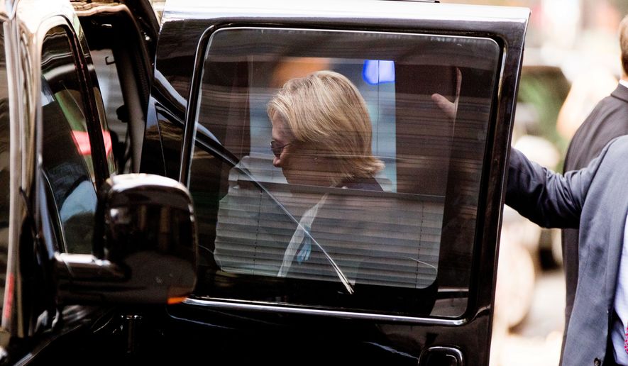 Democratic presidential candidate Hillary Clinton gets into a van as she leaves an apartment building Sunday, Sept. 11, 2016, in New York. Clinton&#39;s campaign said the Democratic presidential nominee left the 9/11 anniversary ceremony in New York early after feeling &quot;overheated.&quot; (AP Photo/Andrew Harnik)