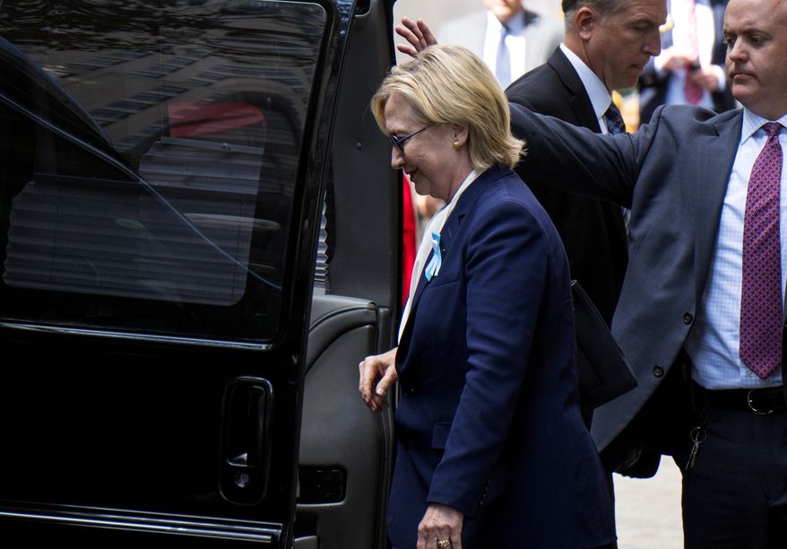 Hillary Clinton walks from her daughter Chelsea&#39;s apartment building Sunday in New York. (Associated Press)