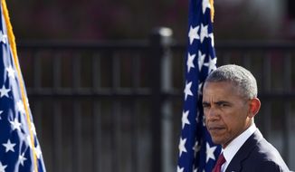 President Barack Obama walks onstage to deliver remarks at the Sept. 11 memorial observance ceremony at the Pentagon, Sunday, Sept. 11, 2016. (AP Photo/Cliff Owen)