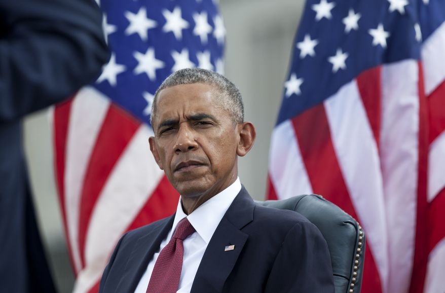 President Barack Obama listens as Secretary of Defense Ash Carter speaks during a memorial ceremony to commemorate the 15th anniversary of the 9/11 terrorist attacks, Sunday, Sept. 11, 2016, at the Pentagon in Washington. (AP Photo/Manuel Balce Ceneta)