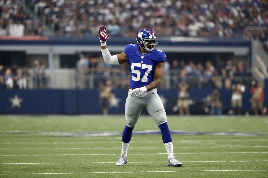 New York Giants linebacker Keenan Robinson (57) signals from the field during an NFL football game against the Dallas Cowboys on Sunday, Sept. 11, 2016, in Arlington, Texas. (AP Photo/Michael Ainsworth)