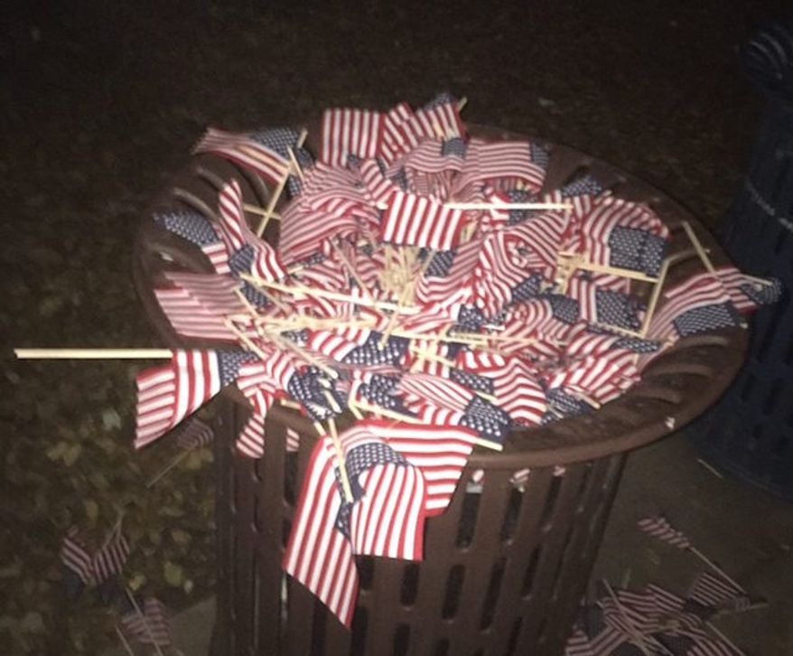 Officials at Occidental College in Los Angeles are investigating the vandalism of a student group's 9/11 memorial in which nearly 3,000 U.S. flags were uprooted and trashed. (Facebook/@Occidental College Republican Club)