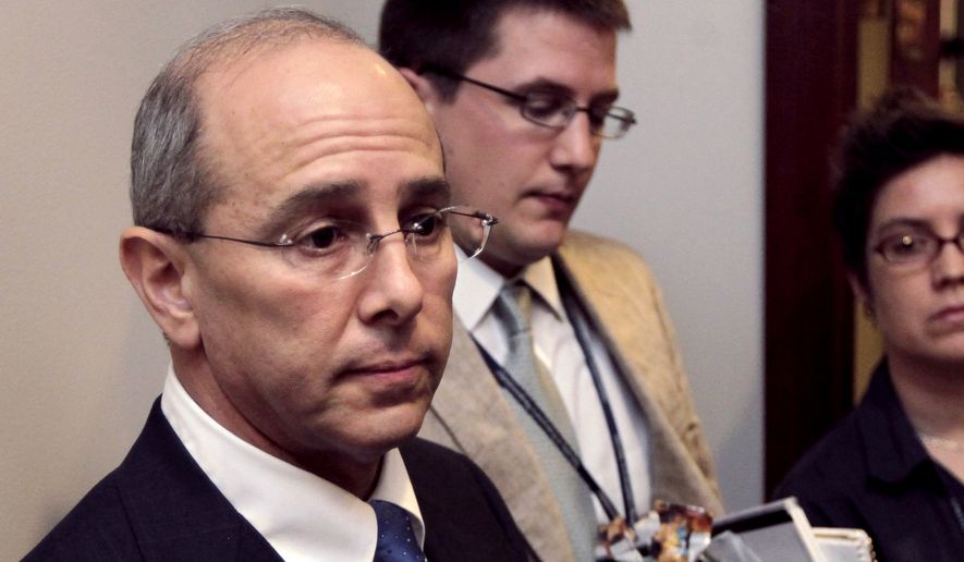 FILE - In this July 21, 2011 file photo, Rep. Charles Boustany, R-La., speaks on Capitol Hill in Washington. Bridget Boustany, the wife of Charles Boustany is defending him against prostitution allegations raised in a new book, describing “false attacks” that she says are aimed at disrupting his bid for a U.S. Senate seat in Louisiana. In an email sent to supporters Monday, Sept. 12, 2016, Bridget Boustany suggests her husband’s opponents are spreading the information, which she called “lies.”(AP Photo/J. Scott Applewhite, File)