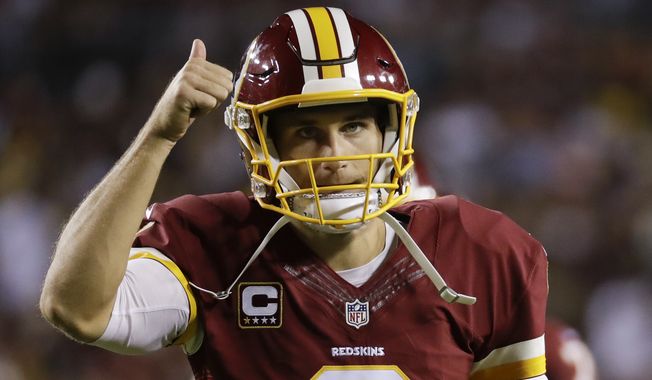 Washington Redskins quarterback Kirk Cousins (8) signals a thumbs up as he leaves the field during the first half of an NFL football game against the Pittsburgh Steelers in Landover, Md., Monday, Sept. 12, 2016. (AP Photo/Patrick Semansky)