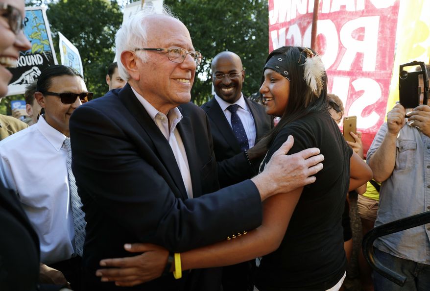 Sen. Bernie Sanders, I-Vt., left, greets Jasilyn Charger, a member of the Cheyenne River Sioux Tribal Youth Council, after Charger spoke to a group of supporters of the Standing Rock Sioux Tribe who were rallying in opposition of the Dakota Access oil pipeline, during a rally by the White House, Tuesday, Sept. 13, 2016, in Washington. Sanders also spoke at the rally. (AP Photo/Jacquelyn Martin) ** FILE **