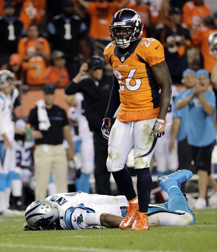 FILE - In this Sept. 8, 2016, file photo, Carolina Panthers quarterback Cam Newton (1) lies on the turf after a roughing the passer penalty was called on Denver Broncos free safety Darian Stewart (26) during the second half of an NFL football game in Denver. s some Broncos players prepare to face the financial consequences of their helmet-to-helmet hits on Cam Newton, they insist they're not a dirty defense, although they don't really mind if that's their reputation. (AP Photo/Joe Mahoney, File) **FILE**