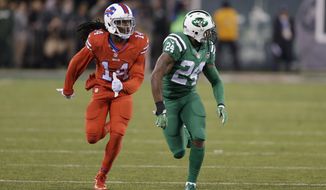 FILE - In this Nov. 12, 2015, file photo, Buffalo Bills wide receiver Sammy Watkins, left, is defended by New York Jets cornerback Darrelle Revis during the first half of an NFL football game, in East Rutherford, N.J. The NFL isn&#x27;t colorblind to the concerns of its TV audience regarding the &amp;quot;Color Rush&amp;quot; alternate uniforms the Bills and Jets will wear Thursday night, Sept. 14, 2016. That&#x27;s a switch from last year, when Buffalo wore all red and the Jets all green during their prime-time game on Nov. 12. The combinations led to colorblind viewers complaining they couldn&#x27;t determine which team was which.  (AP Photo/Seth Wenig, File)