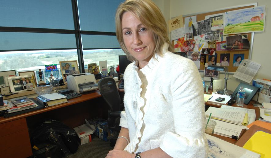FILE - In this April 8, 2008 file photo, Heather Bresch, chief operating officer of Mylan Pharmacueticals, sits in her office in Canonsburg, Pa. Bresch will face lawmakers' questions at a hearing next week on steep price hikes for the company's life-saving EpiPen injector device. (AP Photo/Dale Sparks, File)