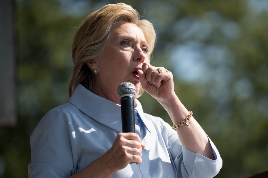 Hillary Clinton stops her speech to cough at Luke Easter Park in Cleveland, Ohio, on Sept. 5. (Associated Press)