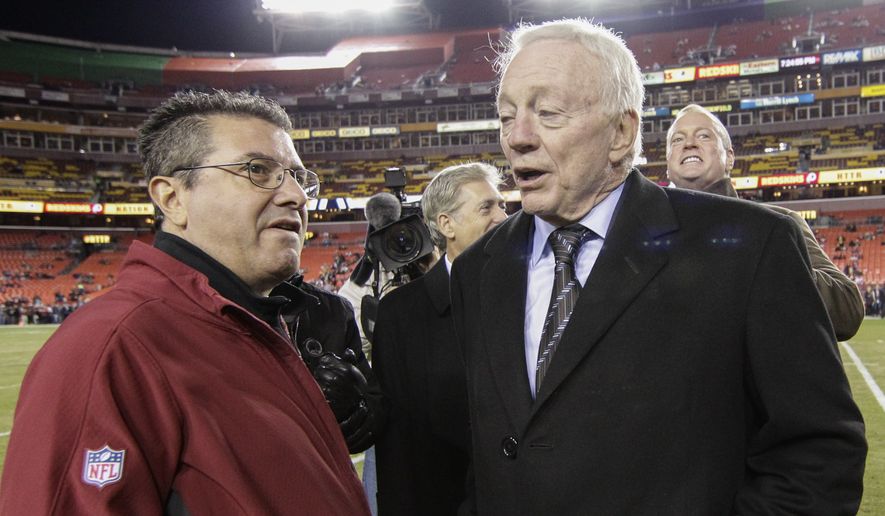 Washington Redskins owner Daniel Snyder talks with Dallas Cowboys owner Jerry Jones, right, before an NFL football game between the Redskins and the Cowboys in Landover, Md., Monday, Dec. 7, 2015. (AP Photo/Mark Tenally) **FILE**