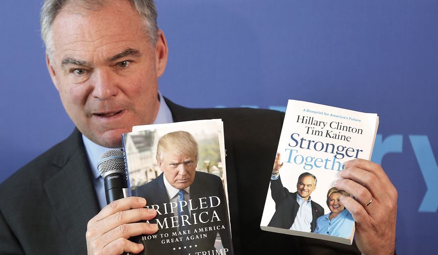 Democratic vice presidential candidate, Sen. Tim Kaine, D-Va. holds up books to show the difference between the two campaigns for president, Thursday, Sept. 15, 2016, in Portsmouth, N.H. (AP Photo/Jim Cole)