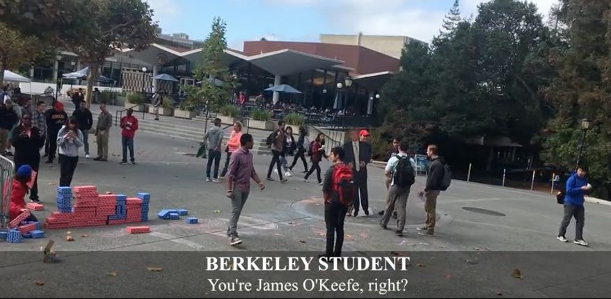 James O'Keefe at the University of California, Berkeley, holds a cut-out of GOP presidential nominee Donald Trump as students engage him on campus. (Source: YouTube Channel: Project Veritas Action)