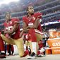 FILE - Int his Monday, Sept. 12, 2016, file photo, San Francisco 49ers safety Eric Reid (35) and quarterback Colin Kaepernick (7) kneel during the national anthem before an NFL football game against the Los Angeles Rams in Santa Clara, Calif. (AP Photo/Marcio Jose Sanchez, File) **FILE**