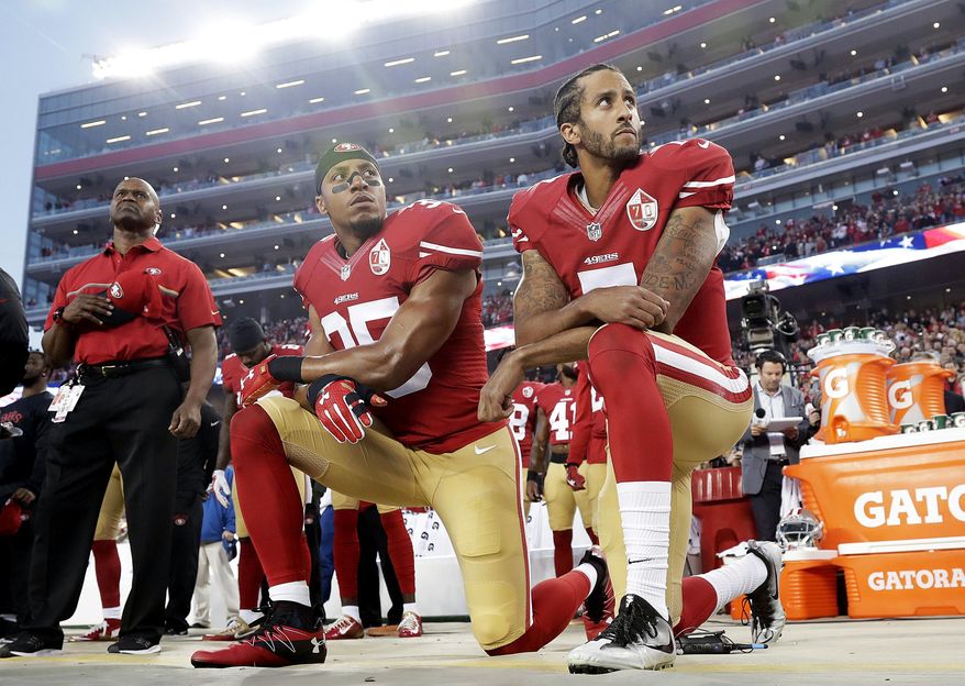 FILE - Int his Monday, Sept. 12, 2016, file photo, San Francisco 49ers safety Eric Reid (35) and quarterback Colin Kaepernick (7) kneel during the national anthem before an NFL football game against the Los Angeles Rams in Santa Clara, Calif. (AP Photo/Marcio Jose Sanchez, File) **FILE**