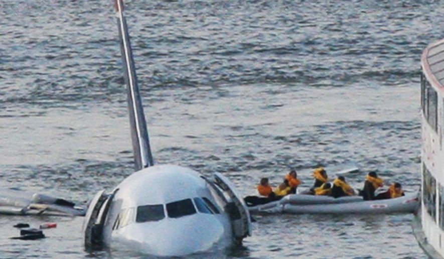 In this Jan. 15, 2009, file photo, passengers in an inflatable raft move away from an Airbus 320 US Airways aircraft that has gone down in the Hudson River in New York. More than seven years after an airline captain saved 155 lives by ditching his crippled airliner in the Hudson River, now the basis of a new movie, most of the safety recommendations stemming from the accident have yet to be followed. (AP Photo/Bebeto Matthews, File)