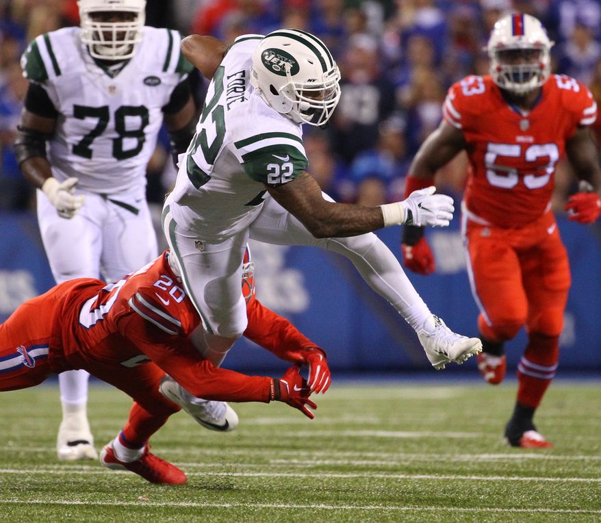 New York Jets running back Matt Forte (22) runs against Buffalo Bills free safety Corey Graham (20) during the second half an NFL football game on Thursday, Sept. 15, 2016, in Orchard Park, N.Y. (AP Photo/Bill Wippert)