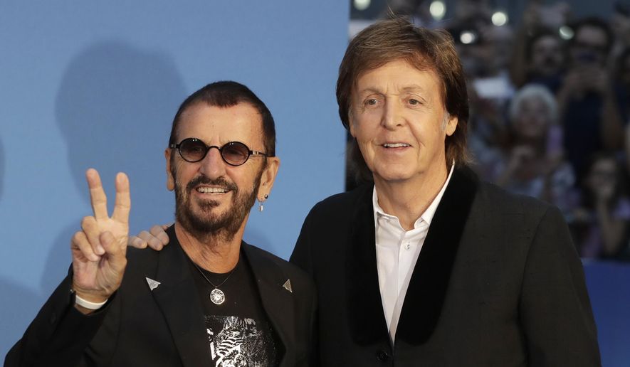 Musicians and members of the Beatles, Paul McCartney, right, and Ringo Starr pose for photographers upon arrival at the World premiere of the Beatles movie, Ron Howard's "Eight Days a Week —The Touring Years" in London, Thursday, Sept. 15, 2016. (AP Photo/Kirsty Wigglesworth) ** FILE **