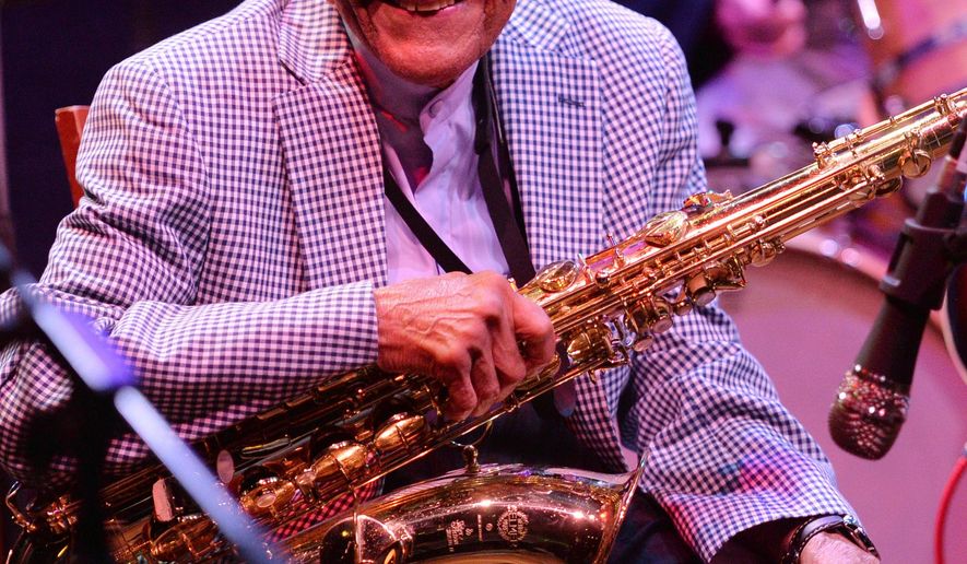 ADVANCE FOR MONDAY SEPT. 19, 2016 AT 12:01 A.M. CDT AND THEREAFTER In this Tuesday, Aug. 16, 2016 photo, St. Paul saxophonist, Irv Williams, smiles as he reminiscences at the Dakota Jazz Club in Minneapolis. Williams was celebrating his 97th birthday. Raised in Cincinnati and Little Rock, Arkansas, Williams started playing music at the age of 6. He took up the saxophone at 12, when he was old enough to join the school band. "I liked that you had to be creative to play jazz music," he said. (John Autey/Pioneer Press via AP)