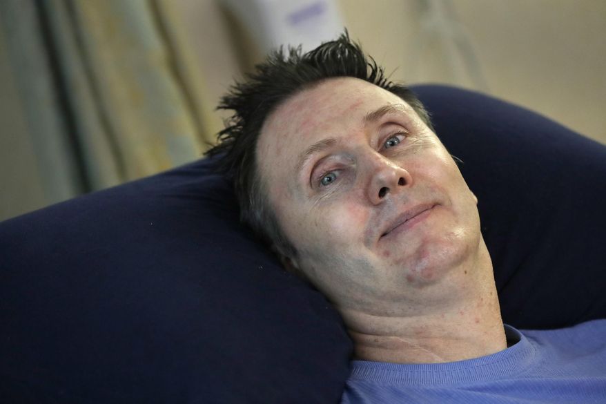 This Sept. 1, 2016 photo shows John Reese at Manor Care Health Services in Appleton, Wis., after recovering from a recent surgery. Fifteen years after a horrific diving incident, the paralyzed former Appleton firefighter has been in assisted living ever since, and has made peace with the reality that he’ll never again enjoy the level of privacy most people have. (Dan Powers/The Post-Crescent via AP)