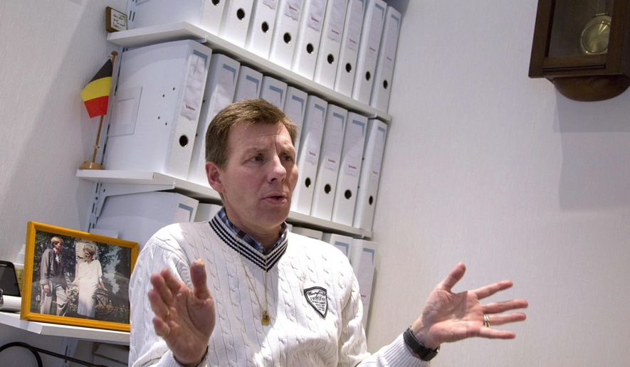 FILE - In this Feb. 7, 2014 file photo, Belgian doctor Marc Van Hoey, a general practitioner who is president of the Right to Die Association in the region of Flanders, speaks with the Associated Press at his practice in Antwerp, Belgium. A terminally-ill minor has become the first juvenile who has been helped to die in Belgium since it removed age restrictions on euthanasia two years ago. Senator Jean-Jacques De Gucht confirmed Saturday, Sept. 17, 2016 that the minor who died was from Belgium's Flemish region and was in the "final stages" of an illness. (AP Photo/Yves Logghe, file)