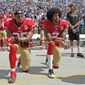 San Francisco 49ers&#39; Colin Kaepernick (7) and Eric Reid (35) kneel during the national anthem before an NFL football game against the Carolina Panthers in Charlotte, N.C., Sunday, Sept. 18, 2016. (AP Photo/Mike McCarn)