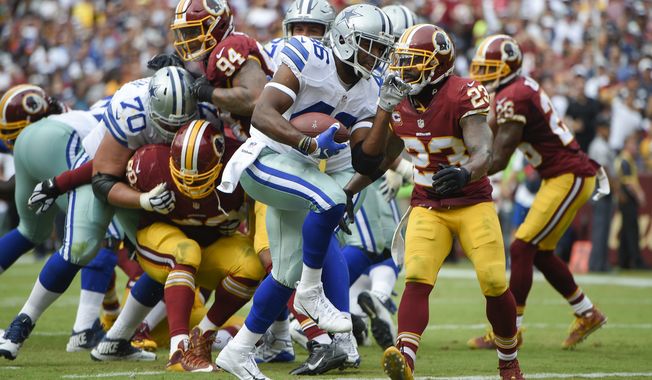Dallas Cowboys running back Alfred Morris (46) carries the ball into the end zone for a touchdown past Washington Redskins free safety DeAngelo Hall (23) during the second half of an NFL football game in Landover, Md., Sunday, Sept. 18, 2016. (AP Photo/Nick Wass)