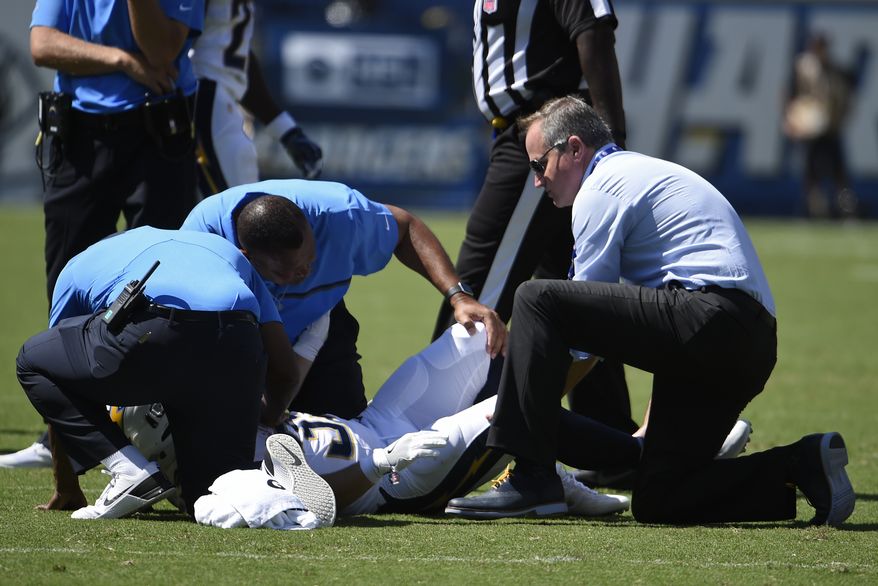 San Diego Chargers running back Danny Woodhead is attended to after an injury during the first half of an NFL football game against the Jacksonville Jaguars Sunday, Sept. 18, 2016, in San Diego. (AP Photo/Denis Poroy)