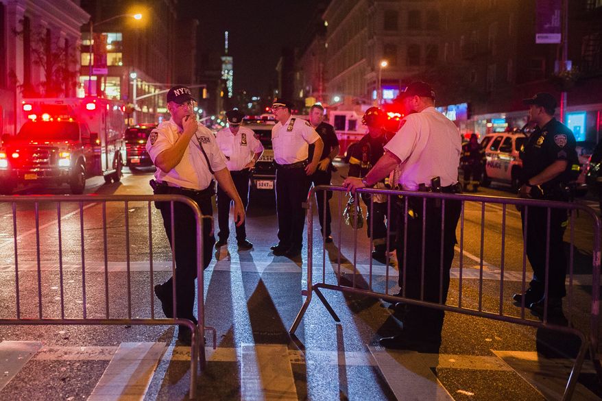 Police work near the scene of an explosion in Manhattan's Chelsea neighborhood, in New York, Saturday, Sept. 17, 2016. An explosion in a crowded Manhattan neighborhood on Saturday night left more than two dozen people injured, and authorities said a second nearby site was also being investigated. Mayor Bill de Blasio called the blast an "intentional act," but said there was no terrorist connection. (AP Photo/Andres Kudacki)
