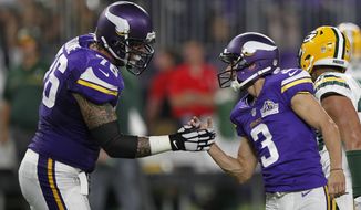 Minnesota Vikings kicker Blair Walsh, right, celebrates with teammate Alex Boone, left, after kicking a 46-yard field goal during the first half of an NFL football game against the Green Bay Packers Sunday, Sept. 18, 2016, in Minneapolis. (AP Photo/Andy Clayton-King)