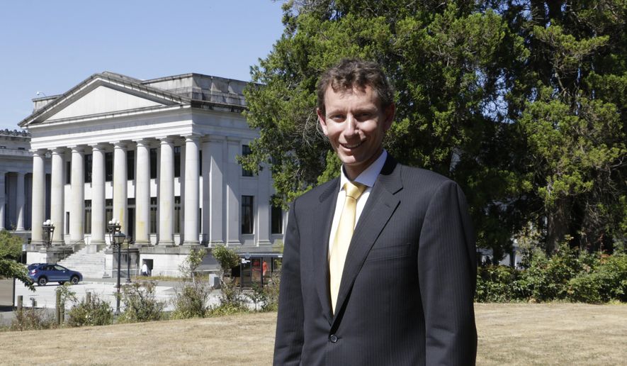 In this photo taken Aug. 29, 2016, Treasurer candidate Michael Waite poses for a photo on the state Capitol campus in Olympia, Wash. It's a foregone conclusion that a Republican will be the next state treasurer in Washington state. That's because the two candidates running in the November election — Duane Davidson and Waite — are both Republicans. (AP Photo/Rachel La Corte)