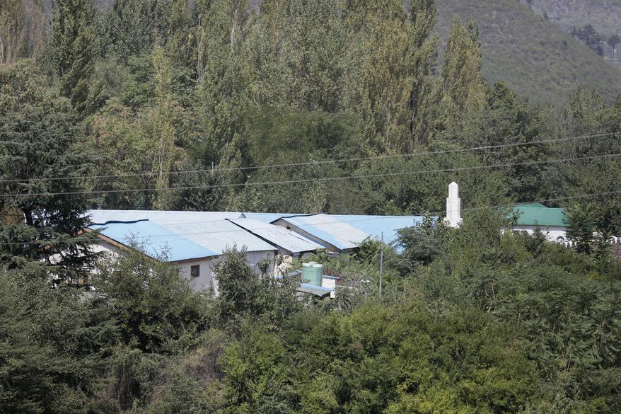 A view of the Indian army base which was attacked by suspected rebels in the town of Uri, west of Srinagar, Indian controlled Kashmir, Sunday, Sept. 18, 2016. Suspected rebels using guns and grenades sneaked into a crucial army base in Indian-controlled Kashmir early Sunday and killed at least 17 soldiers in the deadliest attack on a military base in the disputed Himalayan region in recent years, the army said. (AP Photo/Mukhtar Khan)