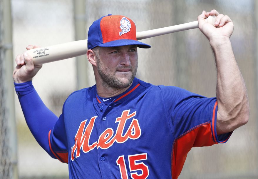 Tim Tebow stretches out before batting practice at the New York Mets' complex, Monday, Sept. 19, 2016, in Port St. Lucie, Fla. The 2007 Heisman Trophy winner and former NFL quarterback got to the complex early Monday, and started his first workout as part of their instructional league team. (AP Photo/Wilfredo Lee) **FILE**