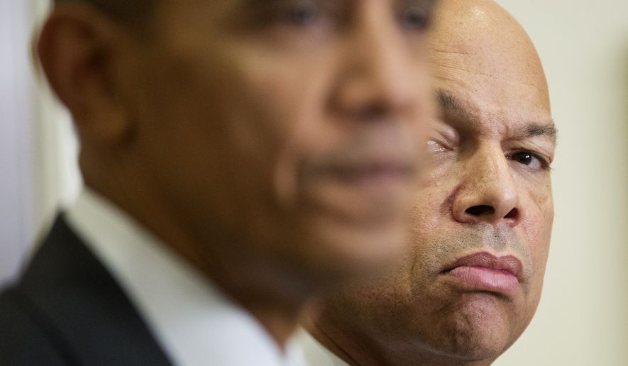 Homeland Security Secretary Jeh Johnson listens at right as President Obama speaks in the Roosevelt Room of the White House in Washington on Nov. 25, 2015. (Associated Press) **FILE**