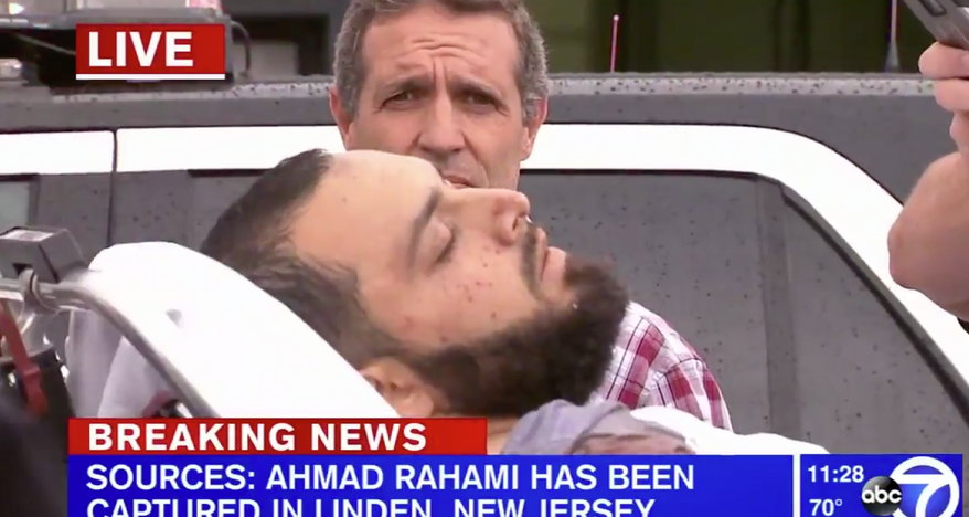 WABC-TV footage showed a man believed to be 28-year-old Ahmad Khan Rahami being loaded into an ambulance on a stretcher in Linden, New Jersey.