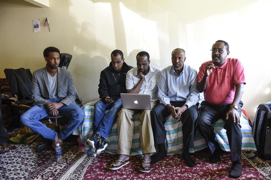 Somali-American leaders hold a press conference Sunday, Sept. 18, 2016, in St. Cloud, Minn., to address the stabbing and shooting incident that happened Saturday at Crossroads Center Mall. A man in a private security uniform stabbed nine people at a Minnesota shopping mall Saturday, reportedly asking one victim if they were Muslim before an off-duty police officer shot and killed him in an attack the Islamic State group claimed as its own. (Dave Schwarz/St. Cloud Times via AP)