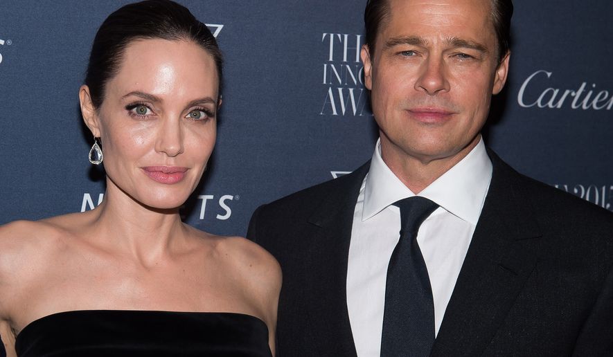 FILE - In this Nov. 4, 2015 file photo Angelina Jolie Pitt and Brad Pitt attend the WSJ Magazine Innovator Awards 2015 at The Museum of Modern Art in New York. Jolie has filed for divorce from Pitt, bringing an end to one of the worlds most star-studded, tabloid-generating romances. (Photo by Charles Sykes/Invision/AP, File)