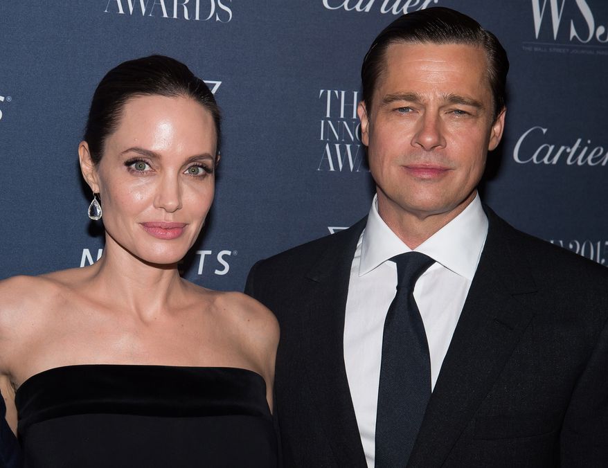 FILE - In this Nov. 4, 2015 file photo Angelina Jolie Pitt and Brad Pitt attend the WSJ Magazine Innovator Awards 2015 at The Museum of Modern Art in New York. Jolie has filed for divorce from Pitt, bringing an end to one of the worlds most star-studded, tabloid-generating romances. (Photo by Charles Sykes/Invision/AP, File)